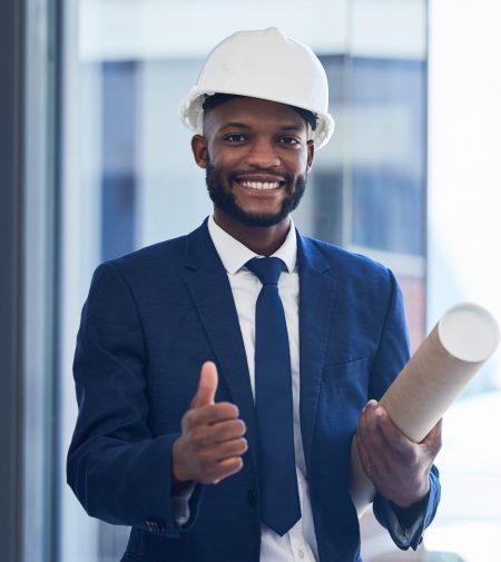 Thumbs up, happy engineer or architect black man with construction success goal target or plan. Support, thank you or construction worker with smile for architecture building design approval portrait.